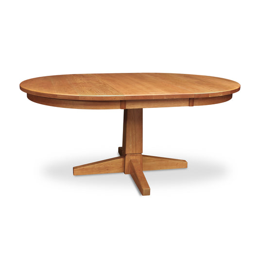 Lyndon Furniture Natural Vermont round extension table with a central pedestal base and smooth wood top.