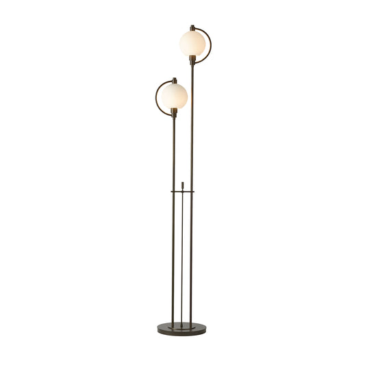 Pluto Floor Lamp by Hubbardton Forge showcasing spherical white shades atop elegant slender poles on a circular base, emphasizing handcrafted artistry.