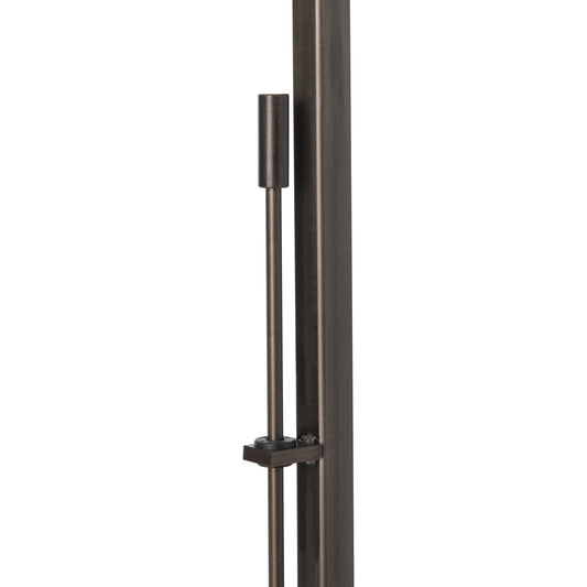 Quill Torchiere by Hubbardton Forge featuring a sleek metal rod, cylindrical weight, and functional clamp design on a vertical pole.