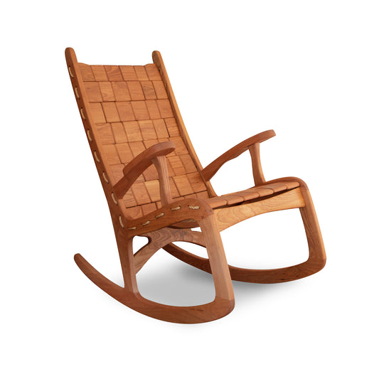 Eco-friendly Quilted Vermont Cherry Rocking Chair featuring a woven seat, curved rockers, and armrests crafted by Vermont Folk Rocker.