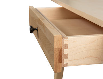 An image of a desk with a drawer.