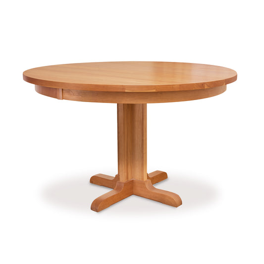 Lyndon Furniture Single-Leg Round Pedestal Table crafted in natural cherry with a solid top, showcasing classic American woodworking and elegant design.
