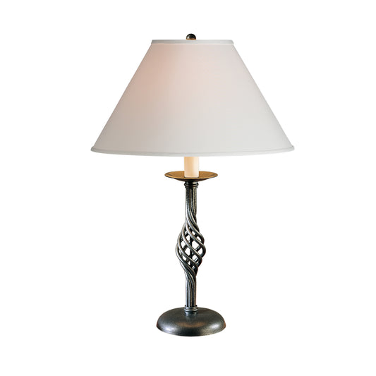 Hubbardton Forge Twist Basket Table Lamp with a white shade and dark twisted metal base, highlighting the lamp's elegant design.