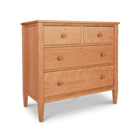 Vermont Shaker 4-Drawer Chest by Maple Corner Woodworks, handcrafted from solid cherry wood with a natural finish; includes two smaller top drawers and two larger bottom drawers with round knobs.