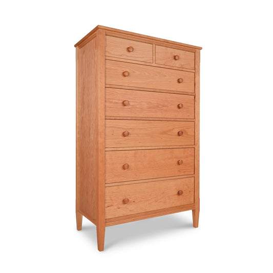 Vermont Shaker 7-Drawer Chest with seven spacious drawers and round wooden knobs, meticulously crafted from premium cherry hardwood.