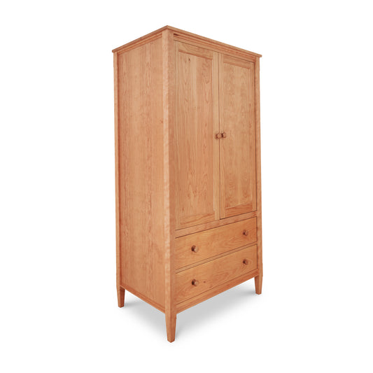 Vermont Shaker Armoire by Maple Corner Woodworks, handcrafted with two doors, two drawers, and round knobs, on small legs