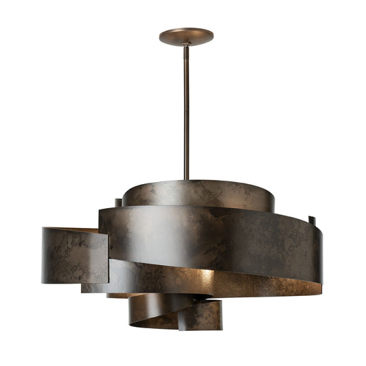 Zen Pendant light by Hubbardton Forge with handcrafted twisted metal design, suspended from a sleek rod and round ceiling mount.